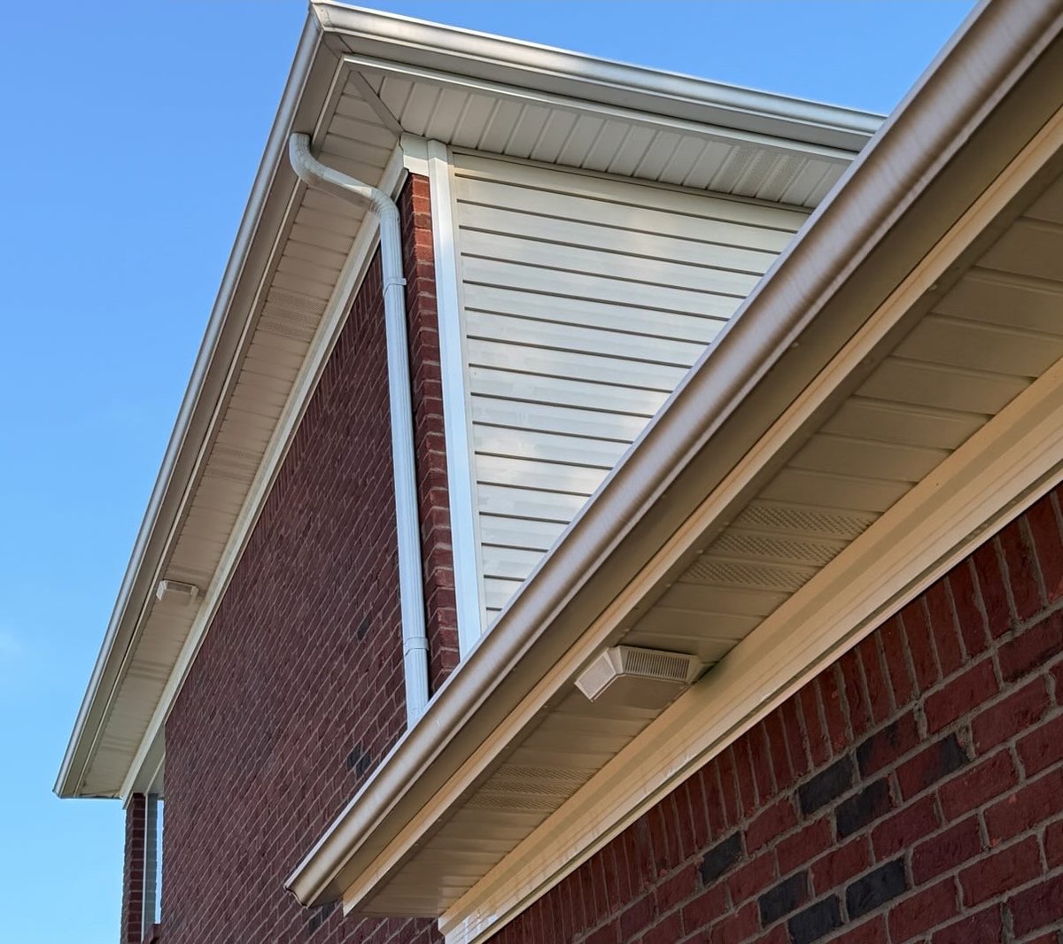 Brick home eave brightened after pressure washing