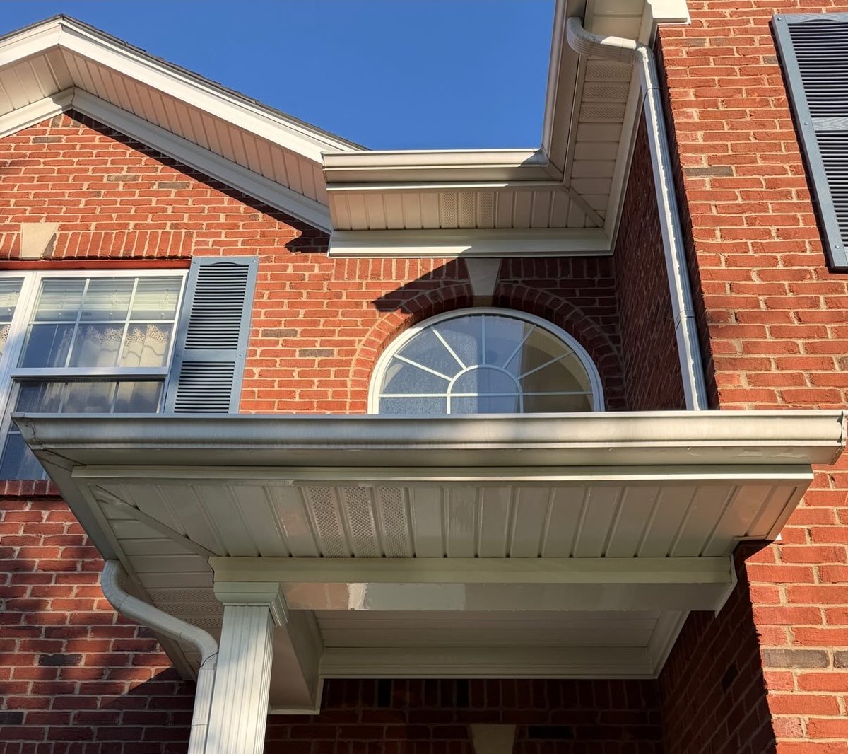 Brick home soffit and trim after soft washing