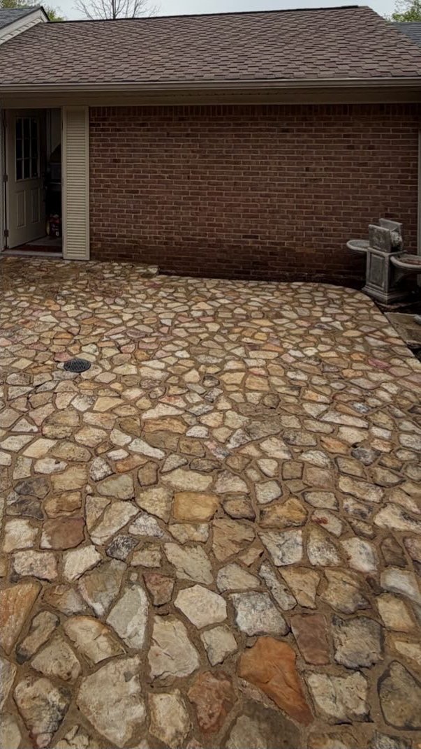 Restored stone patio after pressure washing in Central Kentucky