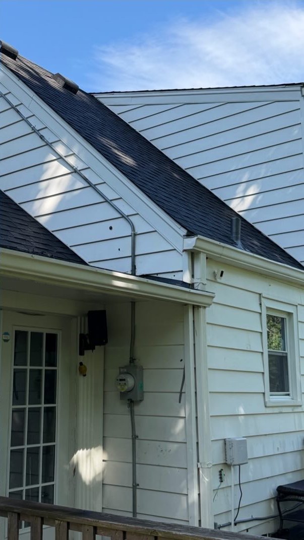 Home roof and siding cleaned after soft washing